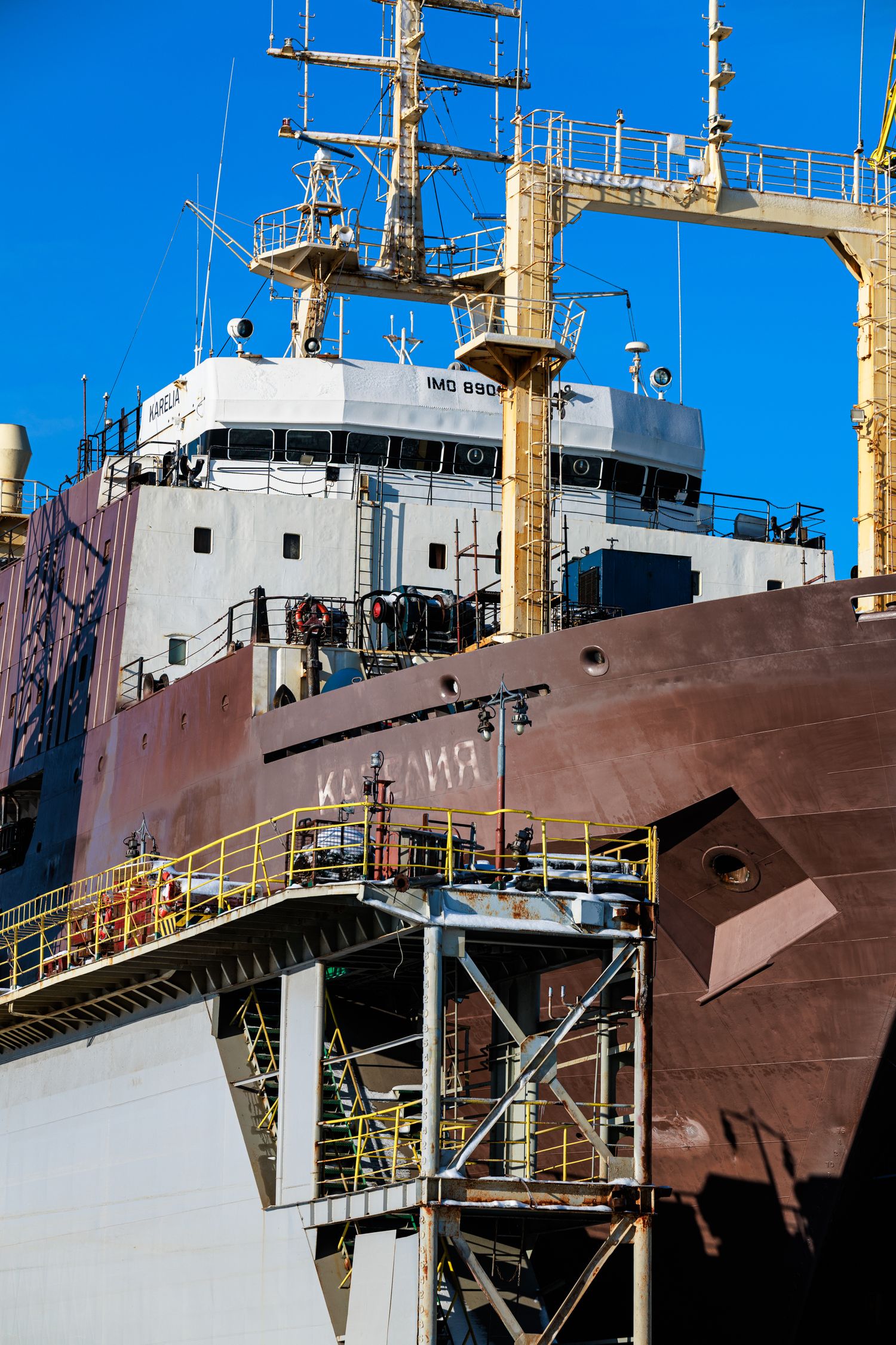 large ship in dockyard undergoing maintenance