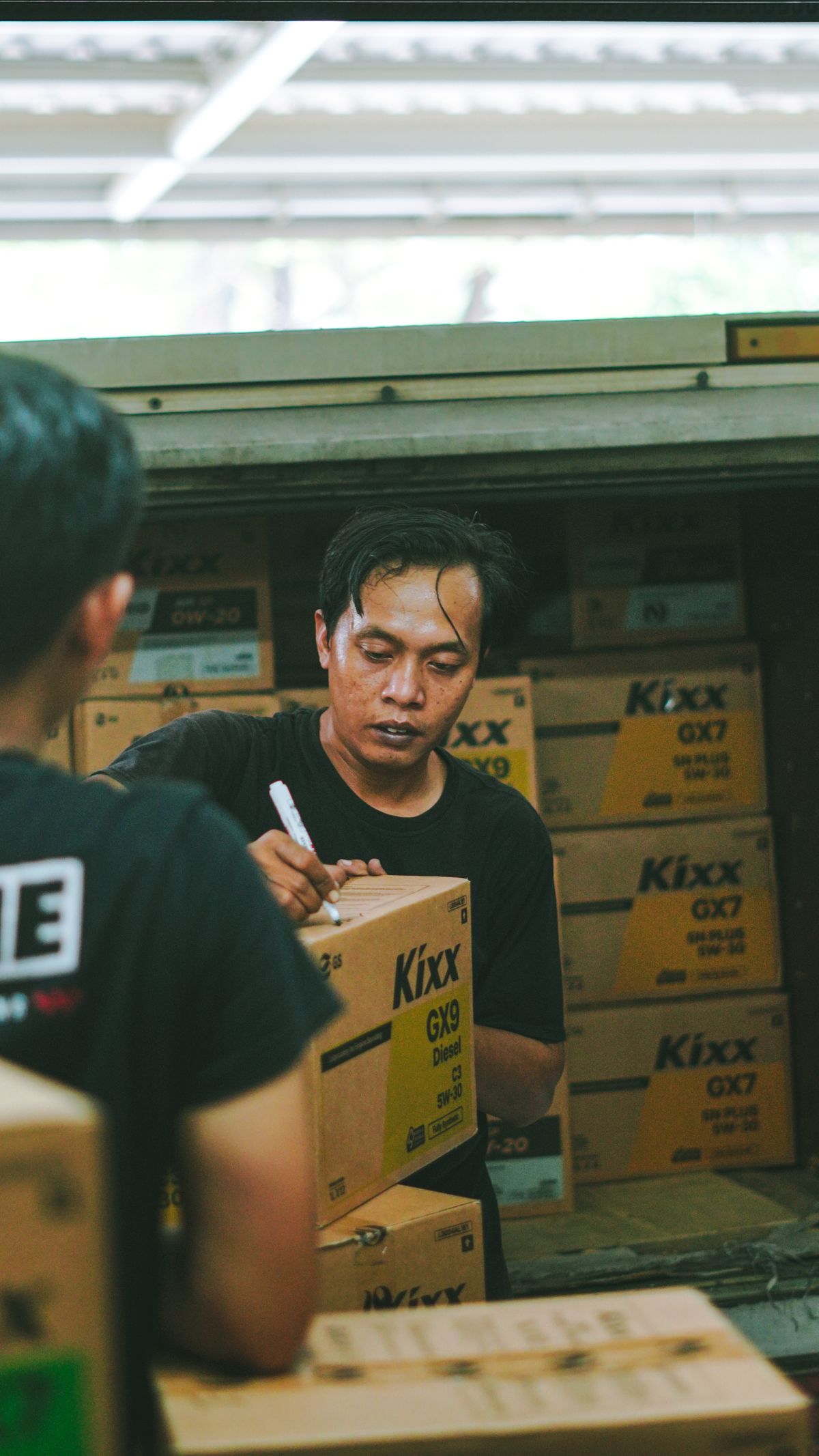 Warehouse workers organising boxed supplies
