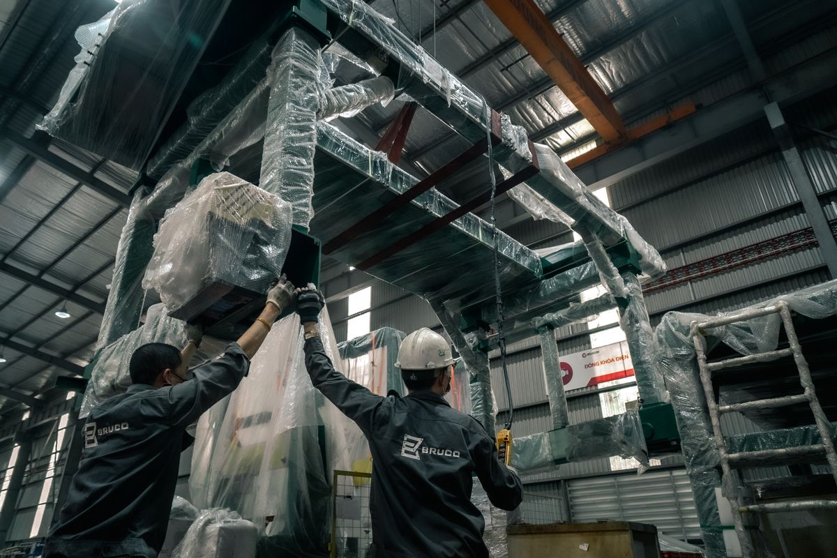 Technicians working on industrial machinery